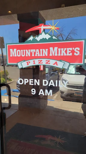 Mountain Mikes Pizza sign on the entrance door